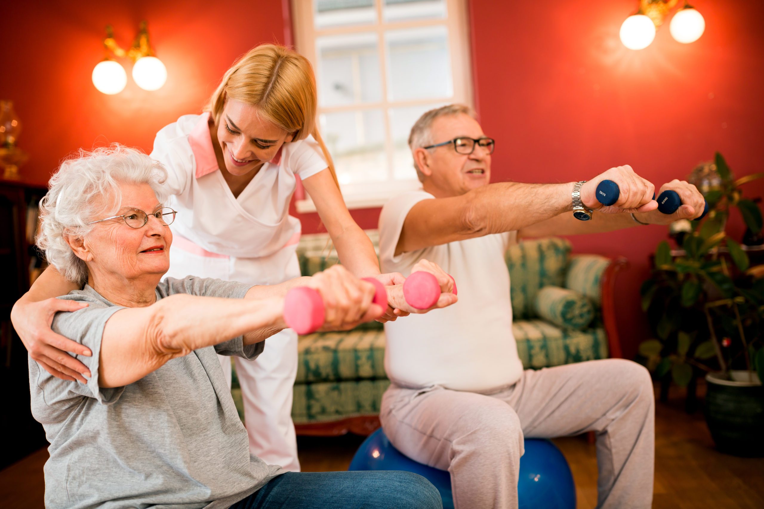 Senior mature people doing exercises with dumbbells